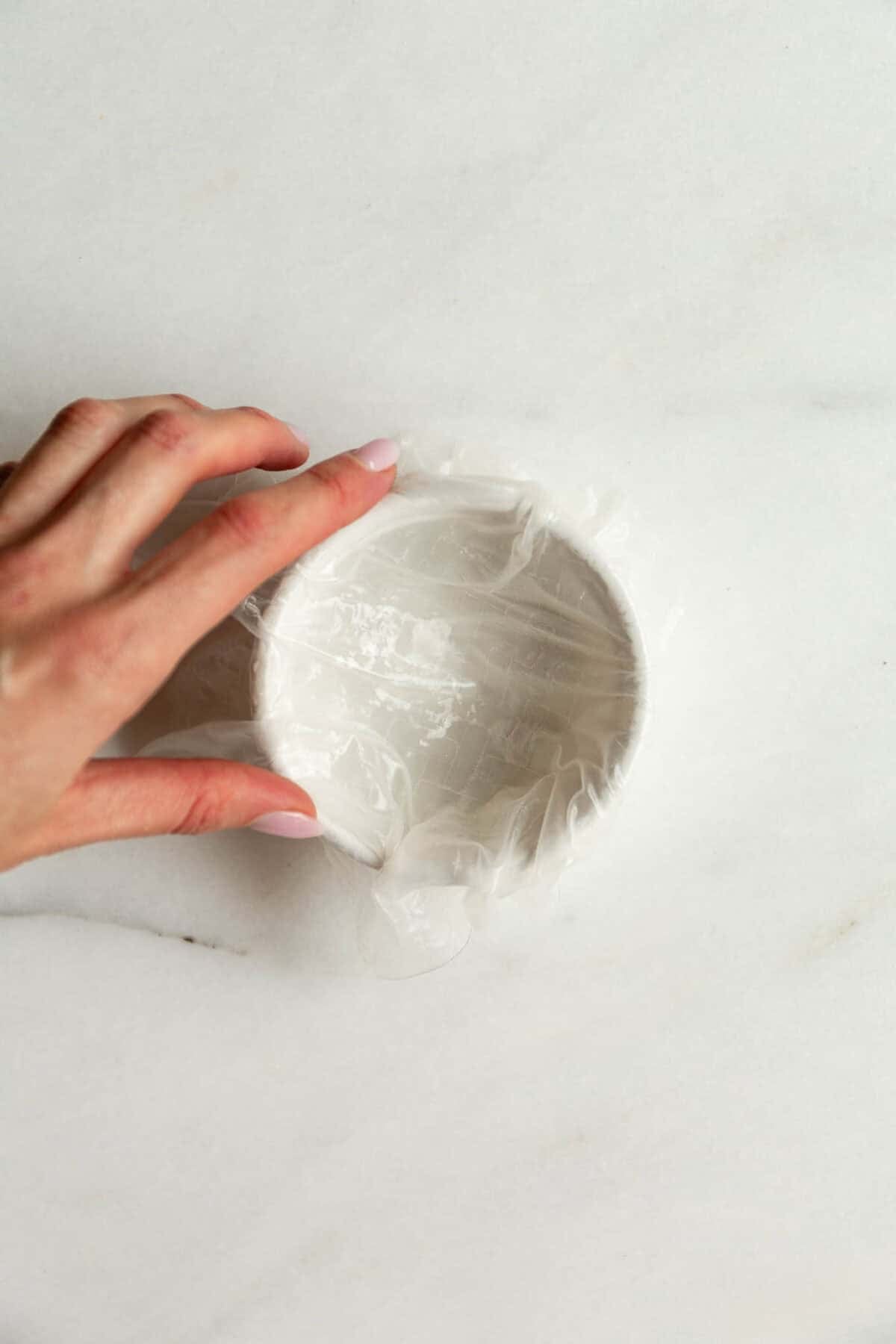 Hand shaping a rice paper mochi ball