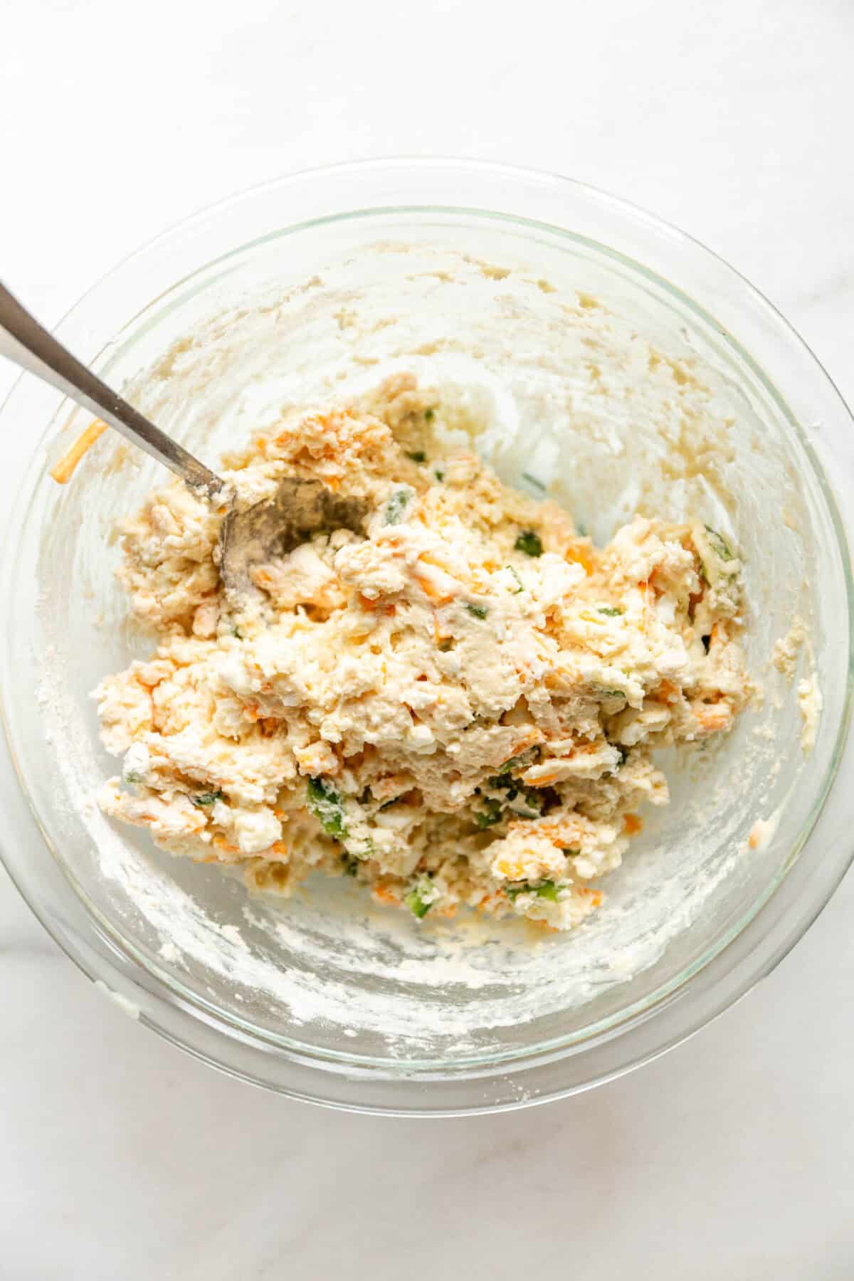 jalapeno cheddar cottage cheese biscuit dough in a glass bowl.
