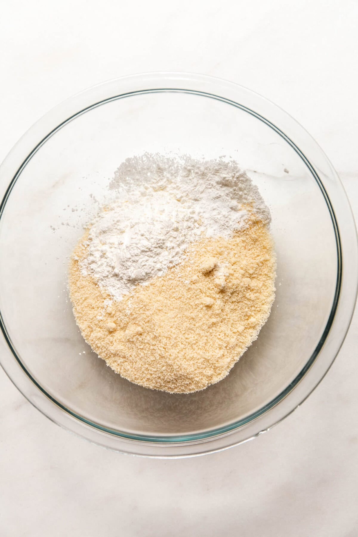 almond flour and cornstarch in a clear mixing bowl.