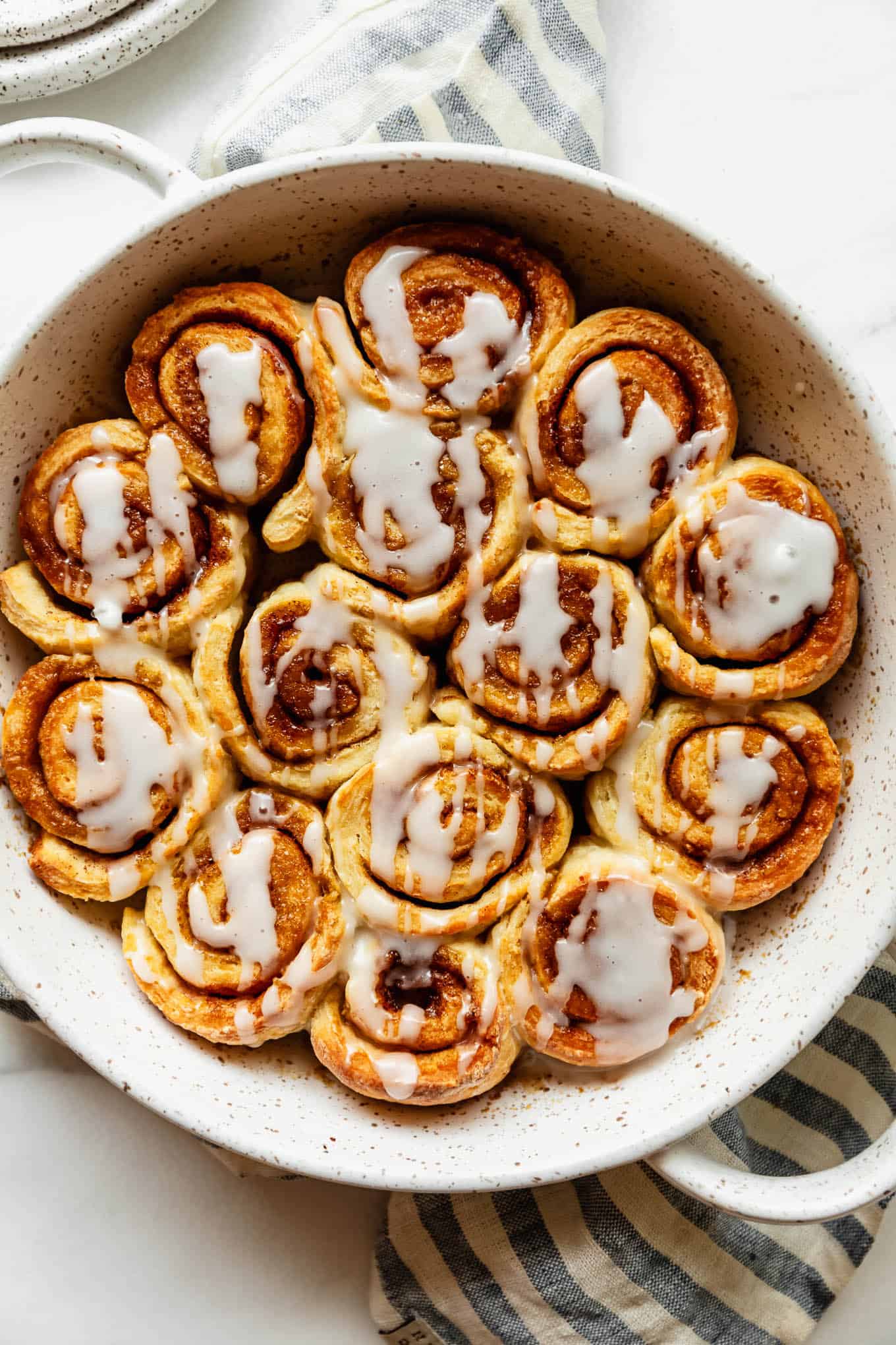Freshly baked cottage cheese cinnamon rolls in a round pan.