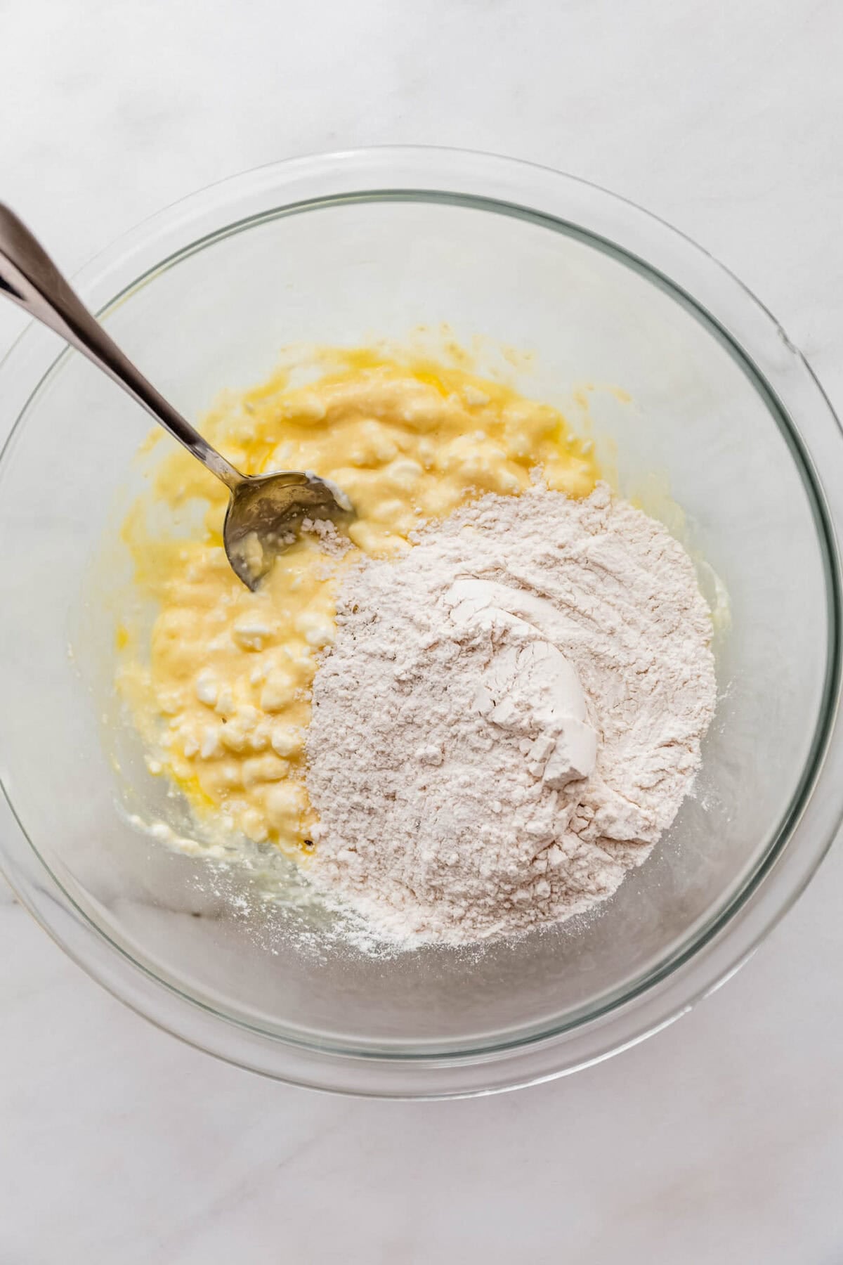 cottage cheese mixture and flour in a mixing bowl.