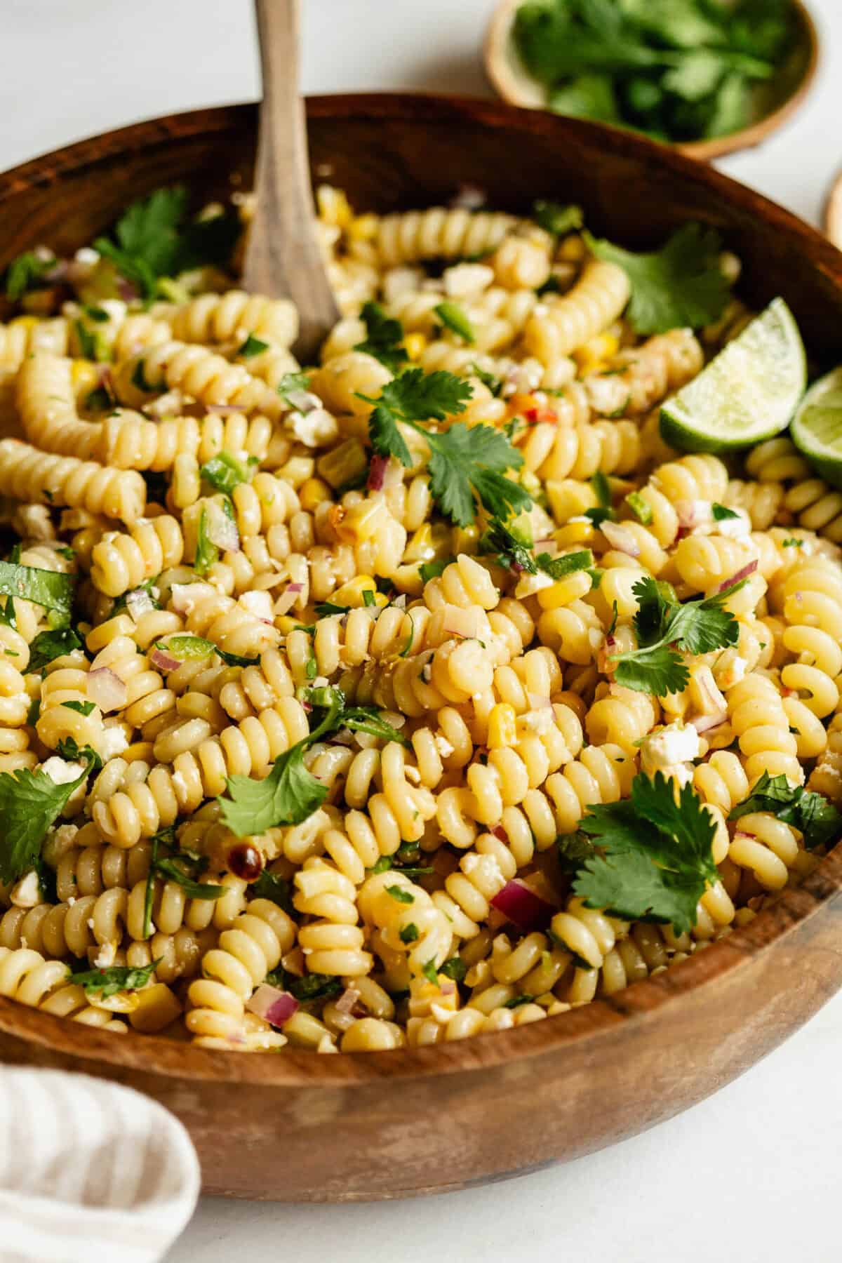 A bowl of elote pasta salad topped with cilantro.