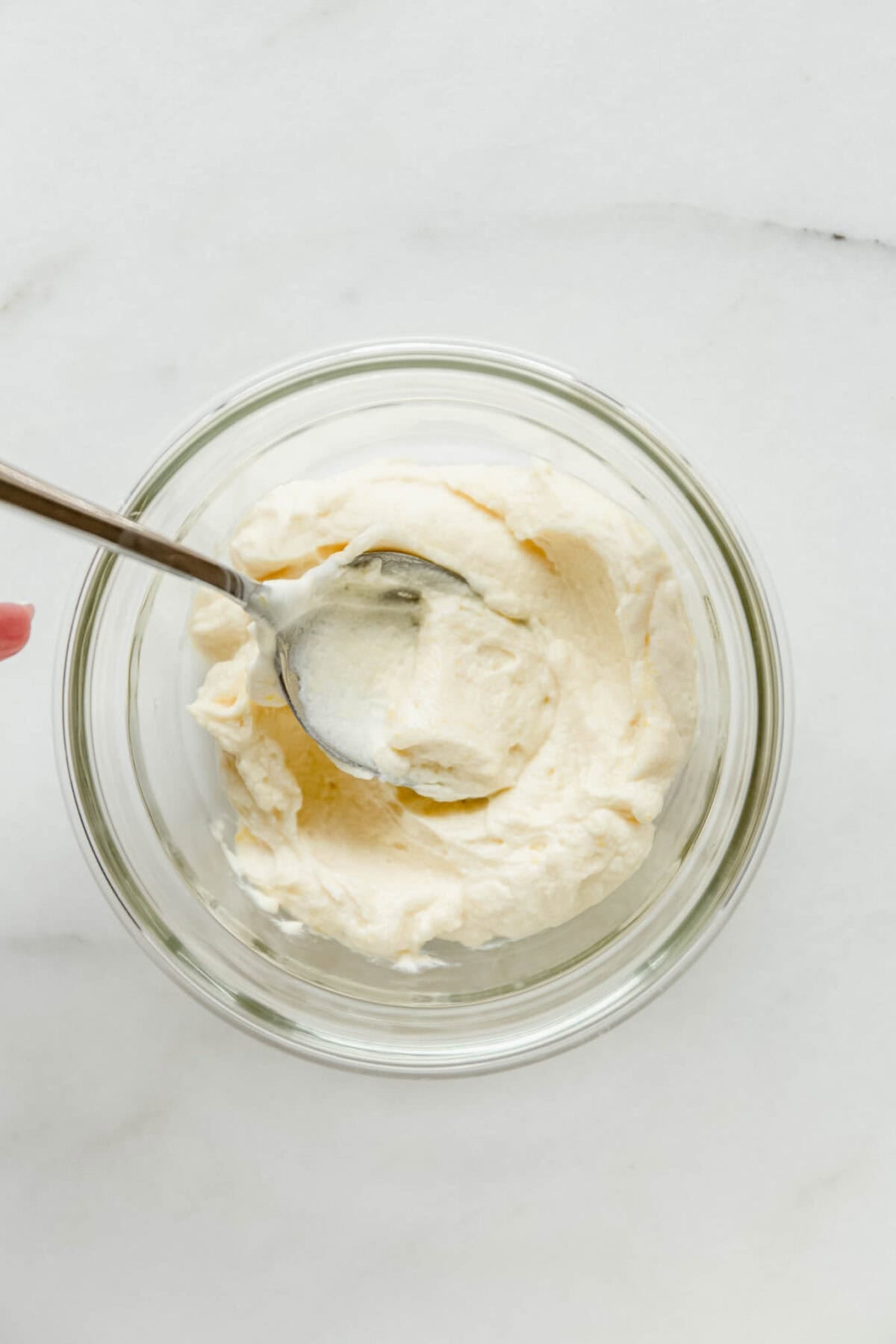 vanilla greek yogurt pudding in a clear container.