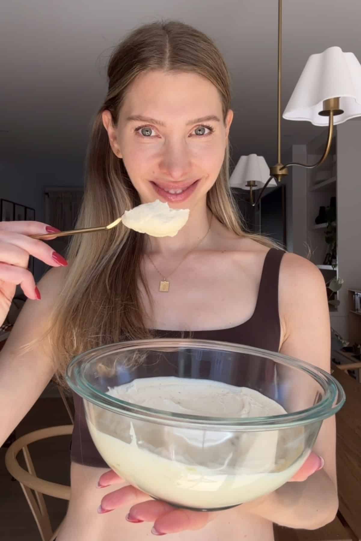Jess from choosing chia holding a bowl of peanut butter mousse.