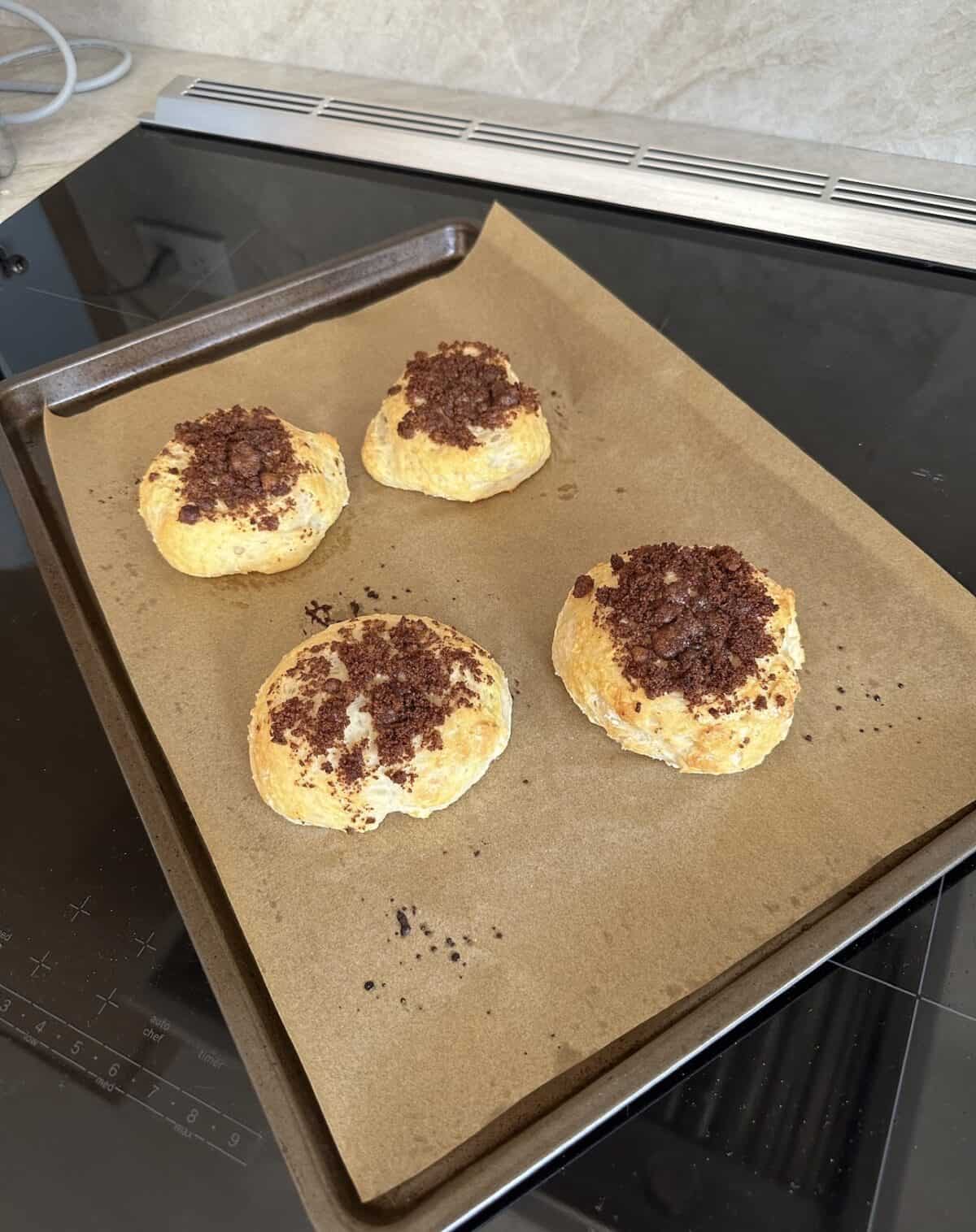 cottage cheese cinnamon crunch biscuit on a baking sheet on top of the stove.