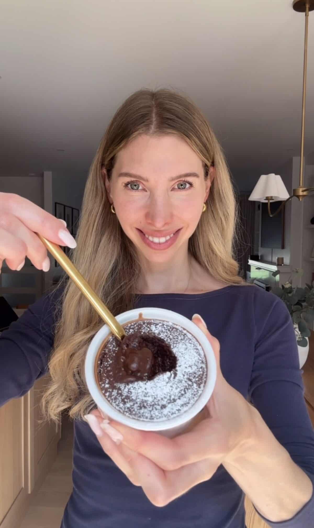 Jess holding a chocolate cottage cheese lava cake.